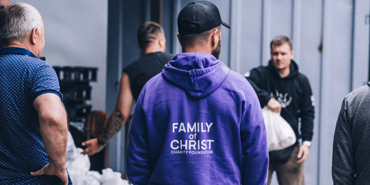 Family of Christ volunteers handing out supplies in Ukraine.